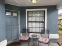 Cozy front porch with seating, offering a welcoming entrance to the home at 2061 Piedmont Park Blvd, Apopka, FL 32703