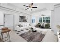 Bright living room featuring neutral decor, stylish furniture, and ample natural light at 3280 Soho St # 306, Orlando, FL 32835