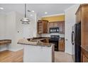 Well-equipped kitchen with granite countertops, a breakfast bar, and stainless steel appliances at 336 E Kaley St, Orlando, FL 32806