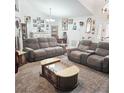 Spacious living room with plush seating, elegant coffee table, and ample natural light, great for entertaining at 4471 Treasure Cay Rd, Tavares, FL 32778