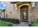 Inviting front entrance with stone accents and manicured landscaping at 8970 Azalea Sands Ln # 2302, Davenport, FL 33896