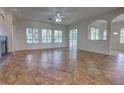 Spacious living room with tile floors, large windows, and a sliding glass door at 1679 Shadowmoss Cir, Lake Mary, FL 32746