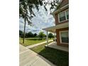 View of the community pond, visible from the home's covered porch at 2200 San Vittorino Cir # 102, Kissimmee, FL 34741