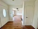 Bright entryway with wood-look floors, offering a glimpse into the expansive living area at 5912 Altec Rd, Orlando, FL 32808
