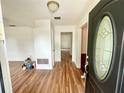 Spacious entryway with wood-look floors, leading to the main living areas at 5912 Altec Rd, Orlando, FL 32808