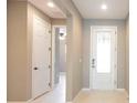 Inviting foyer with neutral paint and sleek tile flooring at 922 Suffolk Pl, Davenport, FL 33896