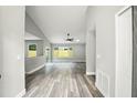 A bright open-concept living area features sleek flooring and neutral paint at 1850 North St, Longwood, FL 32750
