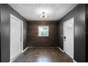 Hallway with tile floors, neutral wall color, and a window for natural light at 1911 Canton St, Orlando, FL 32803