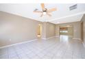 Spacious living room with tiled floors, ceiling fan, and lots of natural light at 2918 E Central Blvd, Orlando, FL 32803