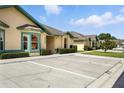 Street view of a single-story home with well-manicured landscaping and ample parking at 3280 Villa Way Cir, St Cloud, FL 34769