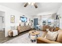 Bright living room featuring a comfortable sofa, stylish furnishings, and a serene ambiance with lots of light at 1100 E Caroline St # 204, Tavares, FL 32778