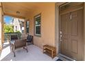 Inviting front porch with seating area and a view of the neighborhood at 12255 Joshua Tree Trl, Windermere, FL 34786