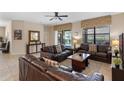 Warm living room featuring neutral paint, three sofas, and access to the pool area at 1442 Moon Valley Dr, Davenport, FL 33896