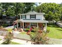 Charming two-story home with a welcoming front porch, brick accents, and a lovely landscaped yard at 3 W Yale St, Orlando, FL 32804