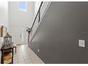 Bright entryway with soaring ceilings and a staircase leading to the upper level at 3055 Ashland N Ln, Kissimmee, FL 34741