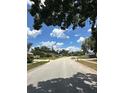 Wide street showcasing well-maintained homes and landscaping in a quiet, residential neighborhood at 448 S Meander Dr, Altamonte Springs, FL 32714