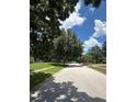 Neighborhood street with mature trees lining the road, providing ample shade and a serene environment at 448 S Meander Dr, Altamonte Springs, FL 32714