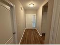 Inviting entryway with wood-look floors, a white front door, and a coat closet at 4792 Summerfield Cir, Winter Haven, FL 33881
