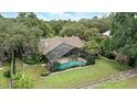 An aerial view of the home, pool and large grassy lawn at 518 Stephanie Ct, Lake Mary, FL 32746