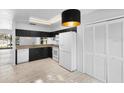Bright kitchen featuring ample storage, modern appliances, and stylish wood-look flooring at 7219 Hunterdon Dr, Orlando, FL 32835