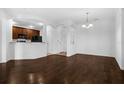 Open-concept living area with hardwood floors, perfect for entertaining at 8192 Boat Hook Loop # 205, Windermere, FL 34786