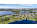 An aerial view of this home in a lakeside community, showcasing its location among lush greenery and waterways at 10117 Atwater Bay Dr, Winter Garden, FL 34787