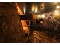 Themed bedroom featuring cave-like interior, star-painted ceiling, and custom lighting, offering a unique sleep experience at 2907 Fable St, Kissimmee, FL 34746