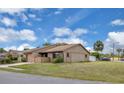 A cozy single-story home sits on a corner lot featuring a neatly manicured lawn and side yard at 3153 Greenwood St # Winter Spr, Winter Park, FL 32792