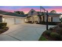 Beautiful home exterior showcasing a spacious driveway, three-car garage, and meticulously maintained landscaping at 3267 Regal Crest Dr, Longwood, FL 32779