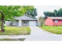 Charming single-story home with a well-maintained lawn and driveway, attached one car garage at 3362 Janet St, Apopka, FL 32712