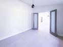 Stylish room boasts modern glass doors and a modern pendant light at 3417 Bay Meadow Ct, Windermere, FL 34786