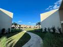 Scenic view of a well-maintained community with lush lawns and beautiful landscaping at 7528 Brooklyn Dr, Kissimmee, FL 34747