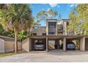 Multi-unit carport showing parking and storage areas under the condos at 108 Crown Oaks Way, Longwood, FL 32779