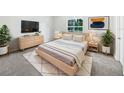 Serene bedroom featuring stylish furniture, soft lighting, and a peaceful atmosphere at 1122 Romar Ln, Apopka, FL 32712
