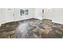 Bright living area showcasing attractive floors and ample space at 1122 Romar Ln, Apopka, FL 32712