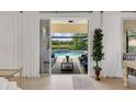 Open floor plan with large sliding glass doors leading to a screened pool area at 11834 Gennaro Ln, Orlando, FL 32827