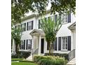Charming two-story home with a manicured lawn, black shutters and well-maintained landscaping at 1649 Lake Baldwin Ln, Orlando, FL 32814