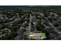A high-angle aerial shot of the home nestled within its surrounding neighborhood at 2033 E Gloria Dr, Deltona, FL 32725