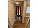 Inviting entryway featuring wood-look floors, a solid door with window accents, and neutral paint at 2414 Willow Oak Dr, Edgewater, FL 32141