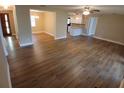 Spacious living room with wood-look floors offering seamless transitions to dining and kitchen areas at 2414 Willow Oak Dr, Edgewater, FL 32141