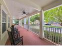 Relaxing front porch with rocking chairs and a brick floor at 315 Desoto Cir, Orlando, FL 32804
