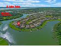 Stunning aerial view of lakefront homes in a beautiful community near Lake Toho and Bald Point Preserve at 3774 Eagle Isle Cir, Kissimmee, FL 34746