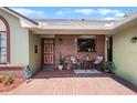 Inviting front porch with brick accents, perfect for relaxing outdoors at 4523 Wyndcliff Cir, Orlando, FL 32817