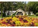 Sign marking the entrance to Mission Inn Resort, surrounded by colorful foliage and manicured landscaping at 9517 San Fernando Ct, Howey In The Hills, FL 34737