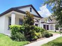 Lovely one-story home featuring a cozy porch, manicured landscaping, and close proximity to neighboring houses at 15071 Guava Bay Dr, Winter Garden, FL 34787