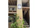 Exterior stairwell of Building 12 features signage with apartment numbers and a view of well-maintained greenery at 199 Afton Sq # 108, Altamonte Springs, FL 32714
