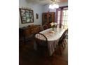 Cozy dining room featuring hardwood floors and sliding glass doors providing plenty of light at 2320 Ne 43Rd St, Ocala, FL 34479