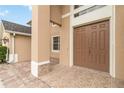Close-up of double front doors and tiled entryway of the home at 2871 Paige Dr, Kissimmee, FL 34741