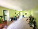 A second view of the expansive, brightly-colored living room; needs some work at 333 Lake Howard Nw Dr # 201A, Winter Haven, FL 33880