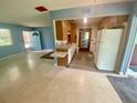 Open kitchen with a breakfast bar and vintage appliances offers a functional layout at 3695 Dale Ct, Mount Dora, FL 32757